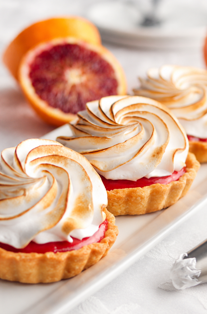 Blood orange meringue tarts with toasted Italian meringue and buttery flaky crust