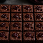 Vampire bite black cherry brownies with dark fudgy squares and ruby puncture filling
