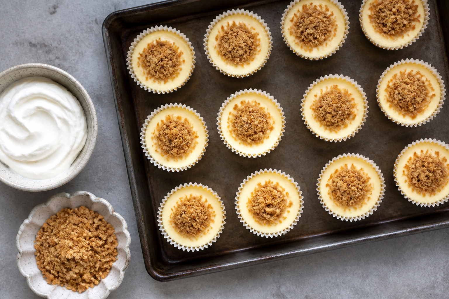 Top-down view of cheesecake cups ready for topping