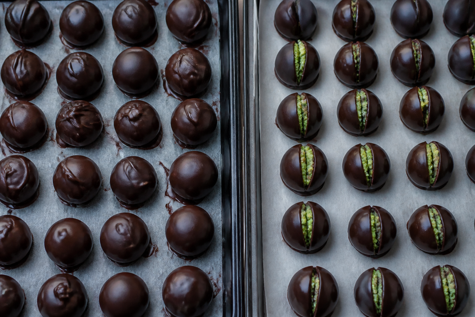 Assembled poison apple truffles chilled and ready for dipping and green drizzle