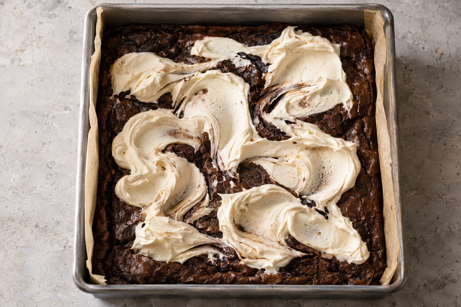 Dolloped mascarpone swirl on cooled brownies before chilling