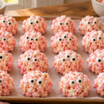Pink strawberry popcorn monster balls with candy eyes