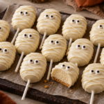 No-bake mummy cheesecake pops with white chocolate bandages and candy eyes