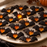 Halloween stained glass bat cookies with orange windows