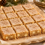 Eggnog blondies with brown butter nutmeg glaze cut into Christmas dessert squares.
