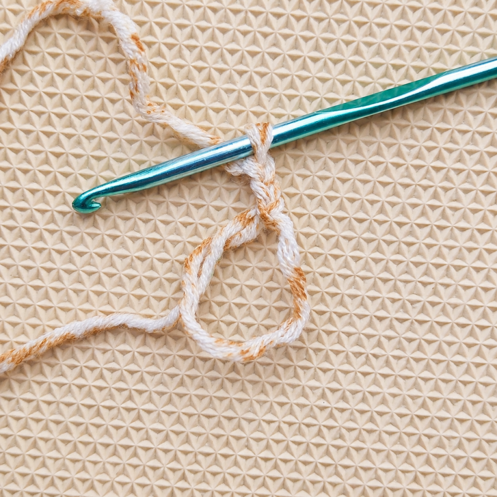 Beginning chain and first double crochet worked into the magic circle.
