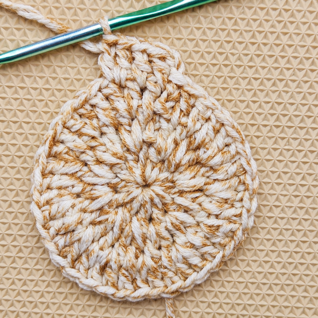 Round 4 increases spaced after every two individual double crochets.
