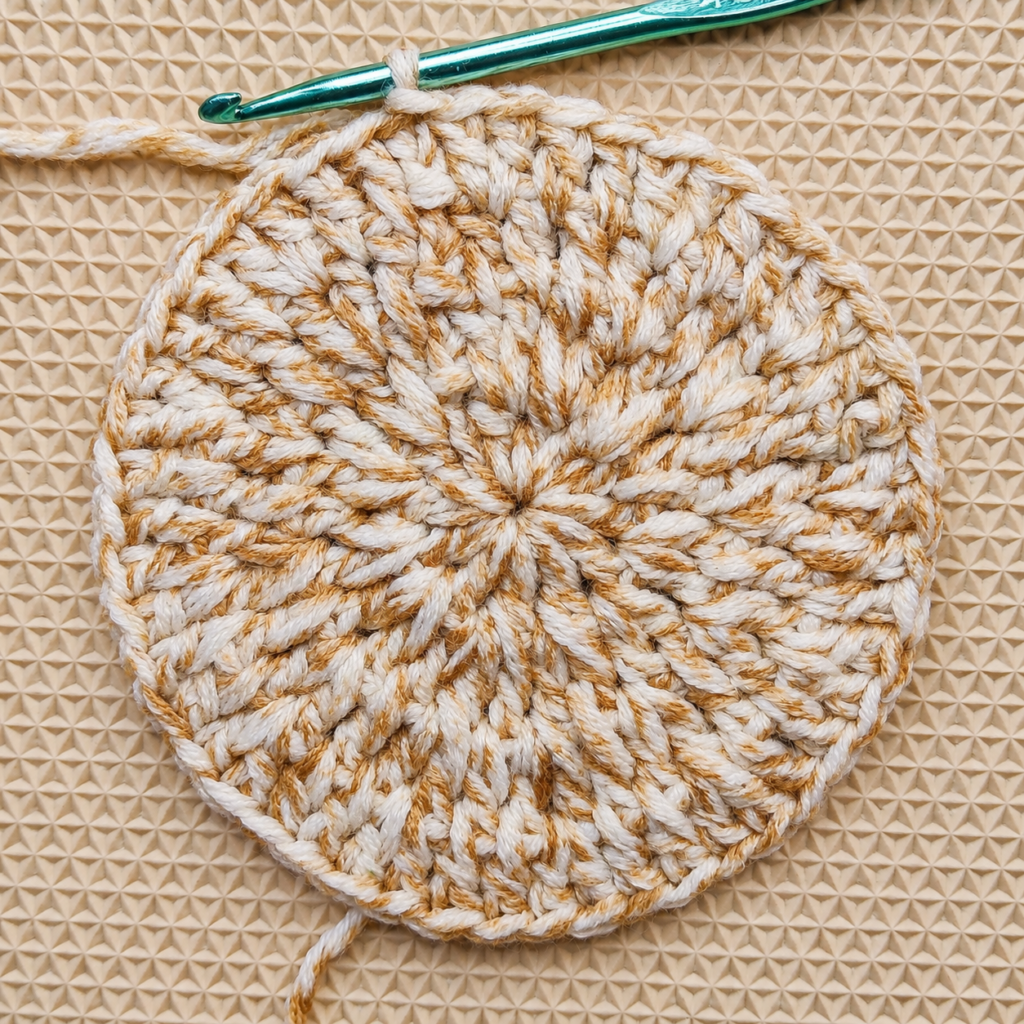 Completed Round 4 crochet circle with forty-eight double crochet stitches.